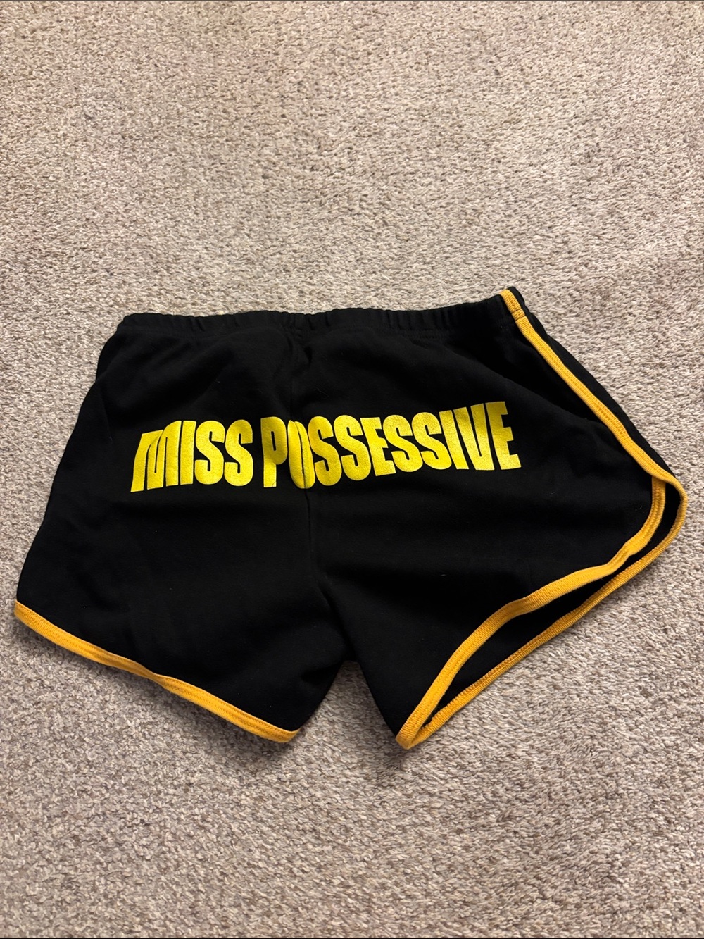 Tate McRae Black Athletic Shorts with Yellow Trim